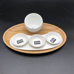 A mignardises (petit four) serving set with Bamboo oval tray and Porcelain dishes to match (Pack of 1)